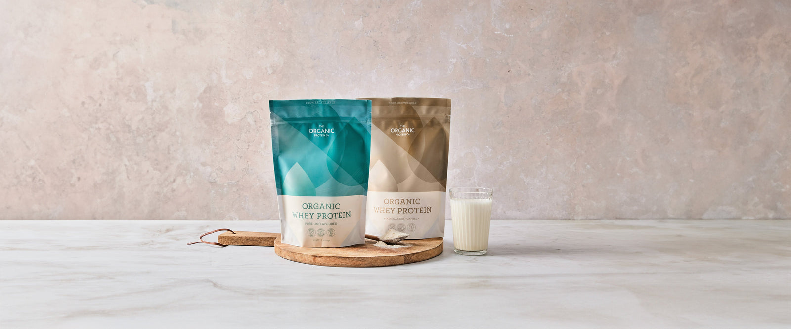 Pouring a glass of Organic Raw Cacao & Maca whey protein powder