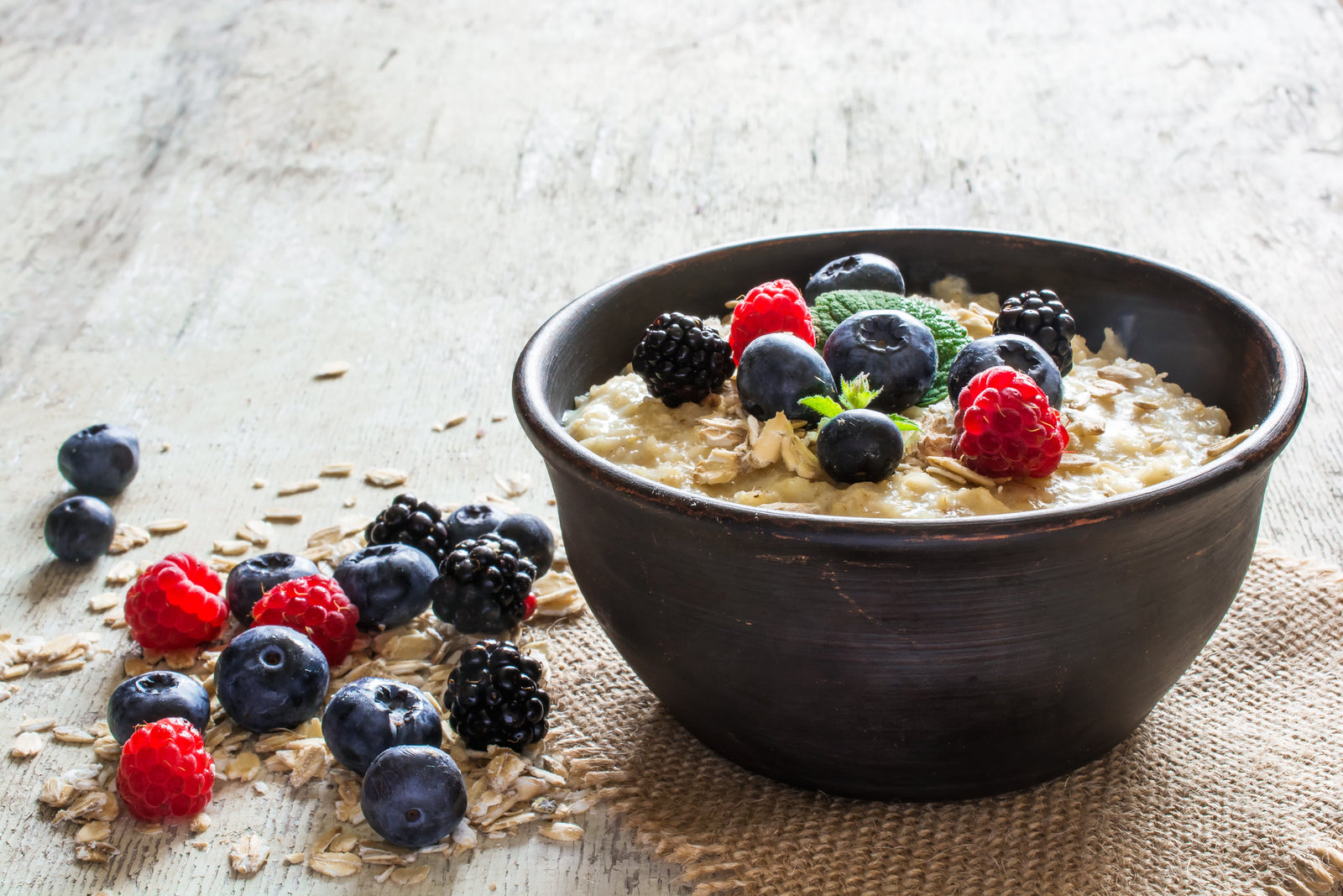 A bowl of protein porridge with berries