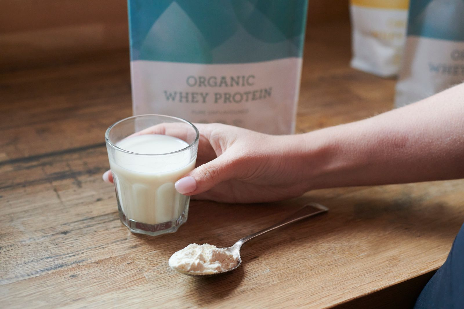 A glass with an unflavoured whey protein shake