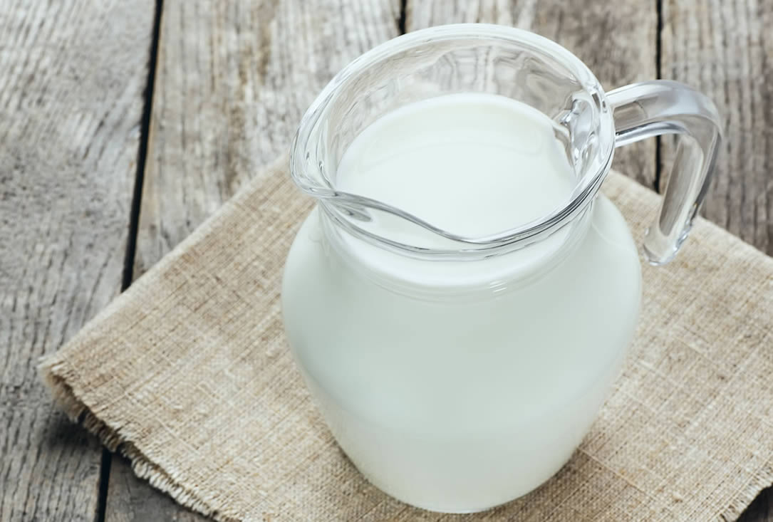 A jug of milk to be used with whey protein powder